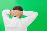 Businessman with hands on back of head