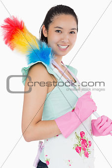 Smiling woman with duster