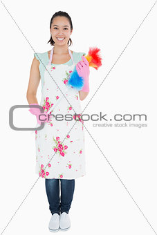 Woman standing with duster