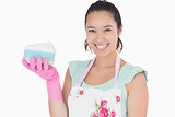 Smiling woman holding a sponge
