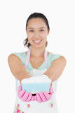 Woman holding a cleaning sponge