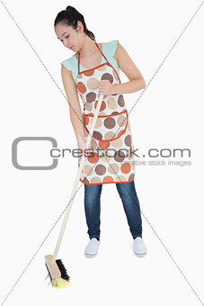 Woman sweeping the floor