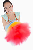 Happy woman holding a duster
