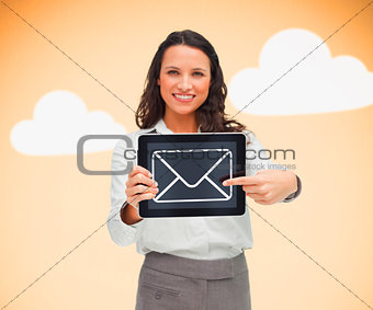 Woman standing holding a tablet pc with a message symbol