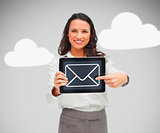 Woman holding tablet pc with email symbol