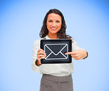 Businesswoman smiling and pointing to mail symbol