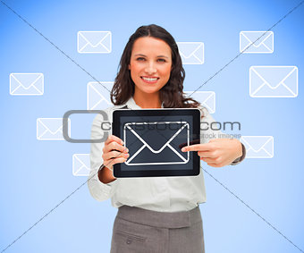 Businesswoman pointing to mail symbol on her digital tablet