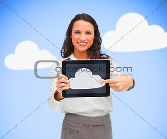 Woman standing holding a tablet pc showing cloud computing symbol