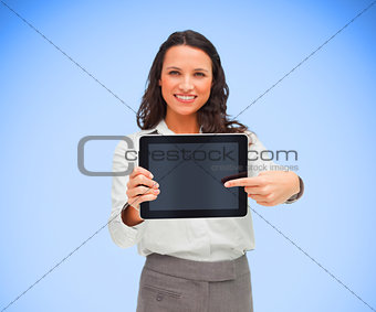Businesswoman pointing on her digital tablet