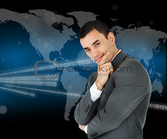 Businessman standing in front of world map