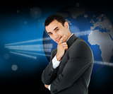 Businessman standing in front of a world map