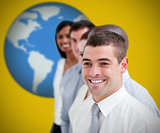 Businesspeople standing and smiling against yellow background