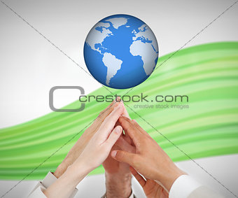 People reaching hands to globe