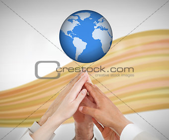 People reaching hands to the globe