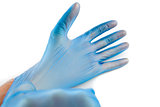 Man putting on rubber gloves