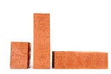 Three clay bricks in different sizes