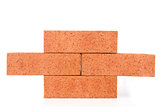Four clay bricks building a wall