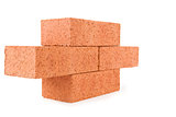 Four clay bricks stacked as a part of a wall