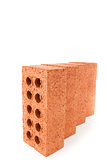 Four clay bricks positioned in a row