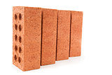 Four red bricks positioned in a row