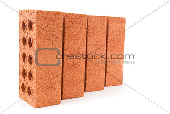 Four red bricks positioned in a row
