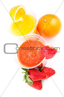 Glasses of orange and strawberry drinks