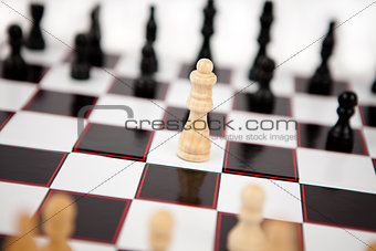 Queen standing in the middle of the chessboard