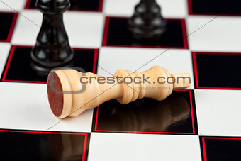 White chessman lying