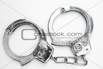 Handcuffs against white background