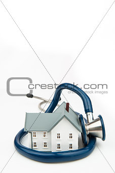 Tiny house surrounded by stethoscope