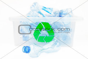 Plastic bottle in front of the box for recycling