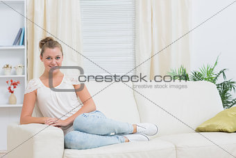 Blonde woman relaxing on couch