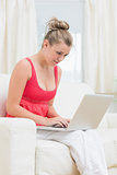 Woman concentrated in using laptop