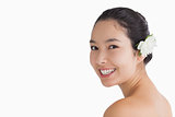 Black haired woman wearing a flower in her hair