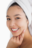 Woman wearing a towel while smiling