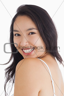Woman smiling while looking natural