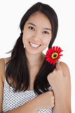 Happy woman holding a flower