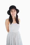 Cheerful woman with a polka dot dress and hat