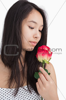 Woman smelling a rose