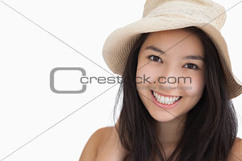 Smiling woman with a straw hat