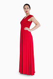 Woman in red dress with her hands on her hips
