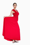 Woman showing the red dress she is wearing