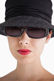 Woman wearing hat and sunglasses