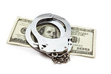 Money and handcuffs lying