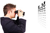 Man doing an eye test with binoculars