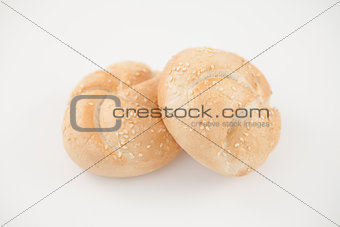 Sesame buns leaning on each other