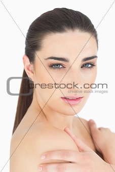 Woman holding her shoulders