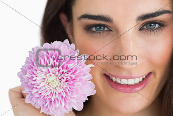 Woman showing a pink flower