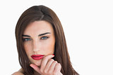 Woman with red lips holding her chin