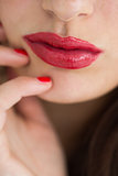 Close-up of woman showing her red lips